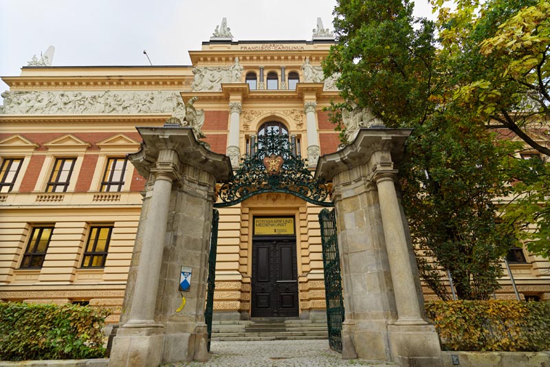 The Francisco Carolinum in Linz, seen through its wrought-iron gate
