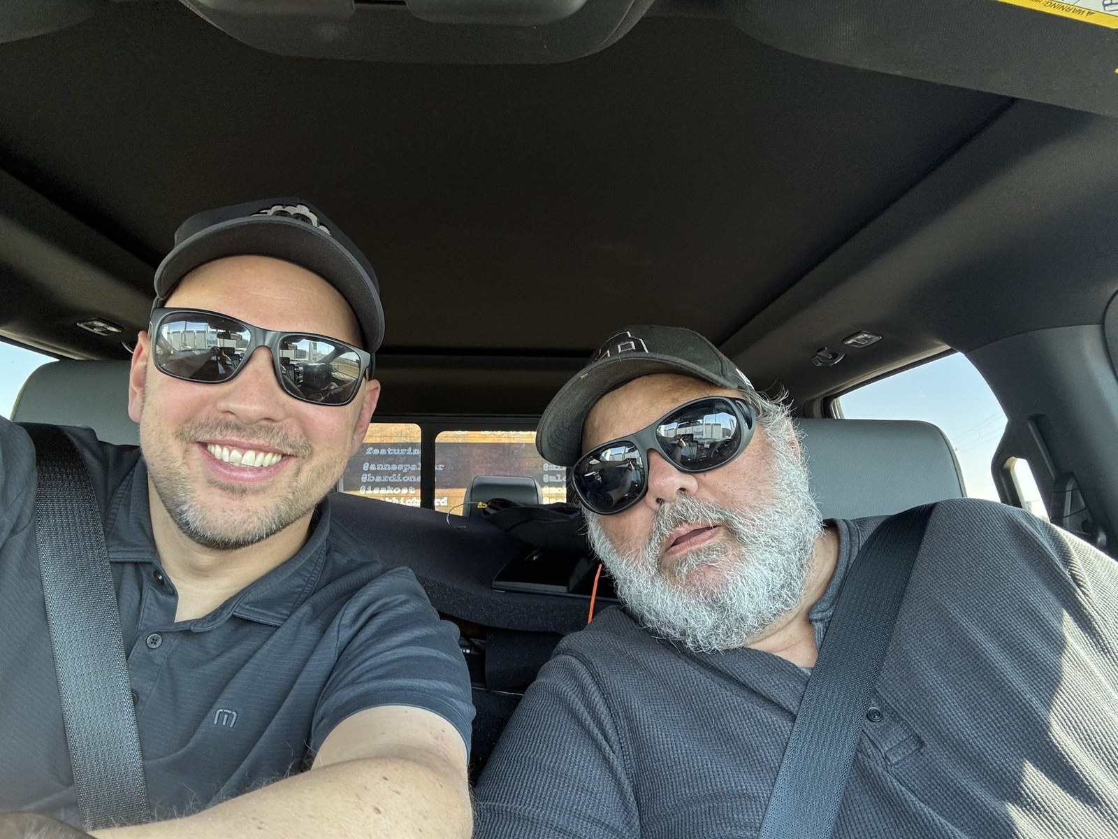 Martin Lukas Ostachowski and Pindar Van Arman in the truck, the featured artists&rsquo; names lettered on the rear window behind them